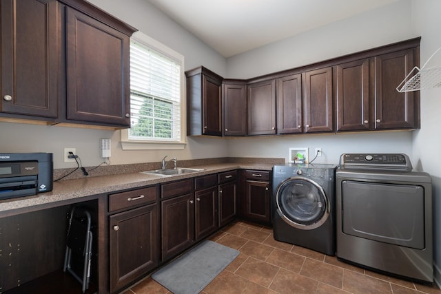 1825 Barnstaple Ln, Brentwood, TN 37027 - laundry room with washing machine and clothes dryer, dark tile patterned flooring, and cabinet space