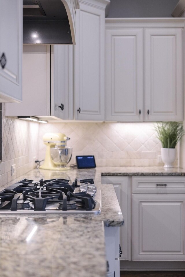 1825 Barnstaple Ln, Brentwood, TN 37027 - kitchen featuring stainless steel gas stovetop, exhaust hood, and white cabinets