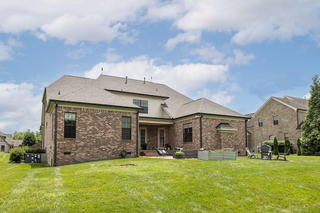 1825 Barnstaple Ln, Brentwood, TN 37027 - rear view of property with a patio, a lawn, brick siding, and a shingled roof