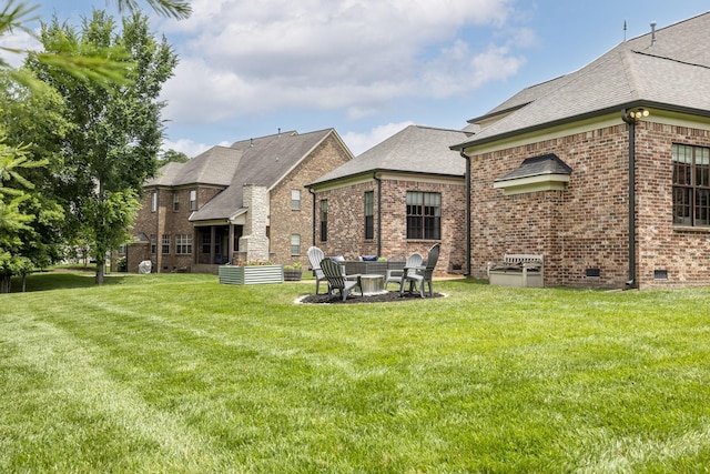 1825 Barnstaple Ln, Brentwood, TN 37027 - back of house with brick siding, a shingled roof, and a lawn