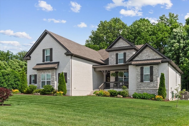 1076 Pretender Way, Columbia, TN 38401 - view of front of house featuring covered porch, brick siding, a front lawn, and cooling unit