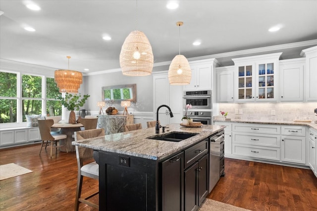 1076 Pretender Way, Columbia, TN 38401 - kitchen with a sink, appliances with stainless steel finishes, white cabinetry, crown molding, and glass insert cabinets