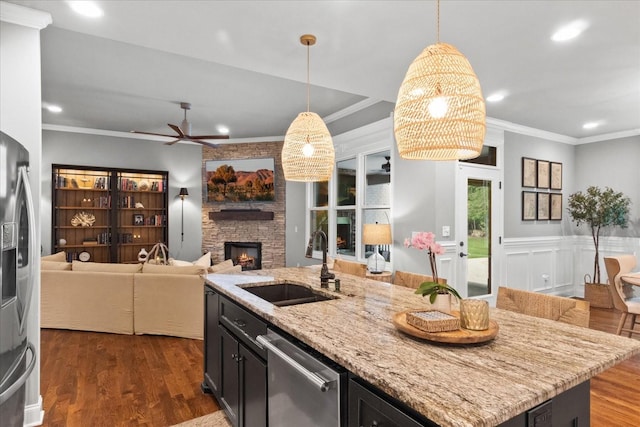 1076 Pretender Way, Columbia, TN 38401 - kitchen with a sink, appliances with stainless steel finishes, a stone fireplace, recessed lighting, and open floor plan