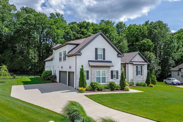 1076 Pretender Way, Columbia, TN 38401 - view of front facade featuring an attached garage, concrete driveway, brick siding, and view of scattered trees