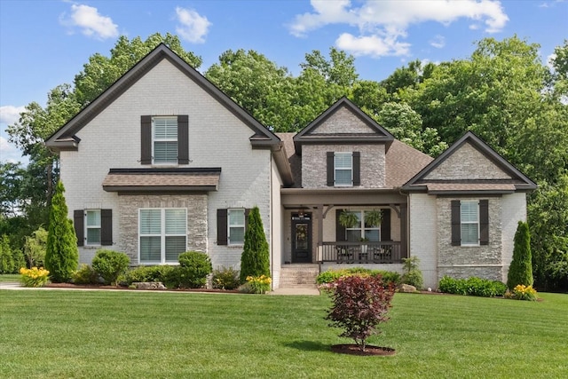 1076 Pretender Way, Columbia, TN 38401 - view of front facade featuring a porch, brick siding, and a front lawn