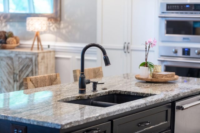 1076 Pretender Way, Columbia, TN 38401 - kitchen with a sink, light stone counters, and appliances with stainless steel finishes