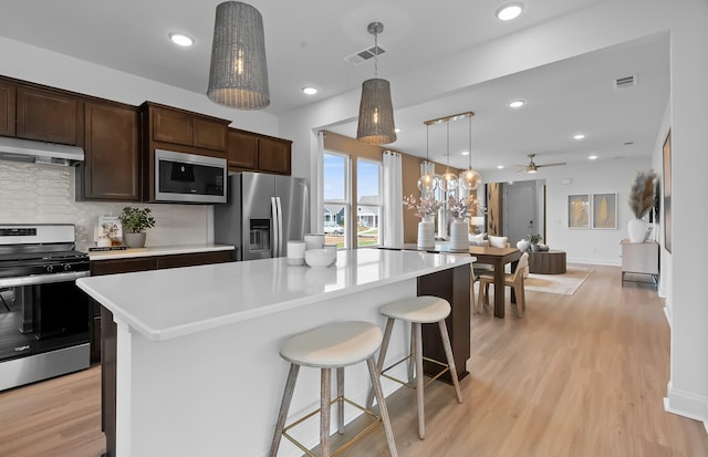 192 Sharp Way, Murfreesboro, TN 37128 - kitchen featuring stainless steel appliances, under cabinet range hood, backsplash, light countertops, and recessed lighting
