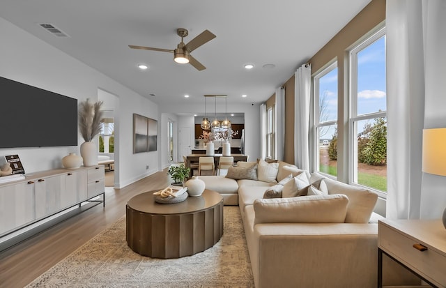 192 Sharp Way, Murfreesboro, TN 37128 - living room with light wood finished floors, ceiling fan, plenty of natural light, a chandelier, and recessed lighting