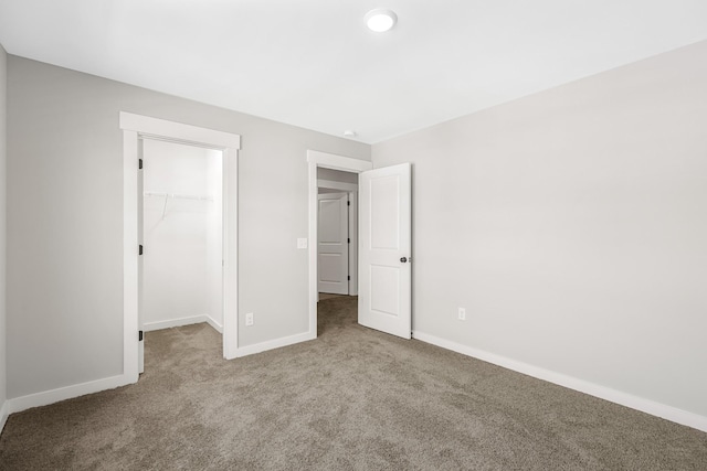 2655 Burton Dr, White House, TN 37188 - unfurnished bedroom with carpet floors, baseboards, a spacious closet, and a closet