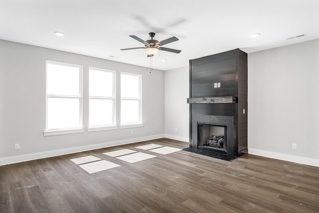 2655 Burton Dr, White House, TN 37188 - unfurnished living room with baseboards, a premium fireplace, wood finished floors, a ceiling fan, and recessed lighting