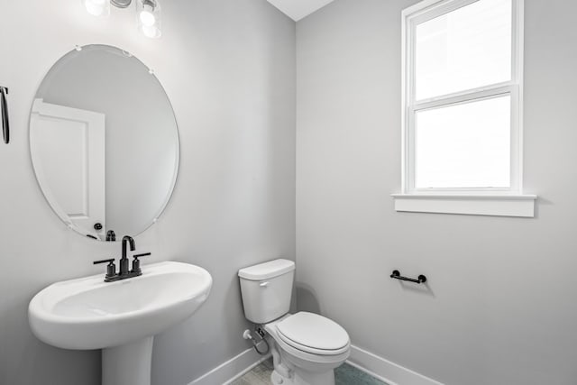 2655 Burton Dr, White House, TN 37188 - half bath featuring baseboards, toilet, and a sink