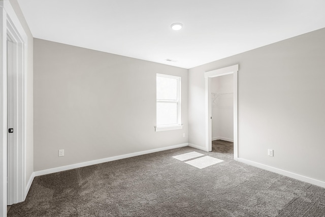 2655 Burton Dr, White House, TN 37188 - unfurnished bedroom with carpet floors, baseboards, a spacious closet, and a closet