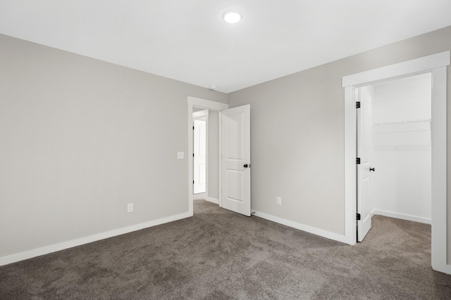 2655 Burton Dr, White House, TN 37188 - unfurnished bedroom with carpet, baseboards, a spacious closet, and a closet