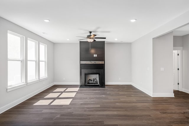 2655 Burton Dr, White House, TN 37188 - unfurnished living room featuring ceiling fan, baseboards, recessed lighting, dark wood-style floors, and a large fireplace