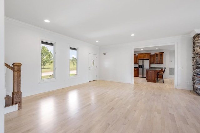 254 Davis Rd, Lebanon, TN 37087 - unfurnished living room featuring light wood-style flooring, ornamental molding, recessed lighting, stairs, and baseboards