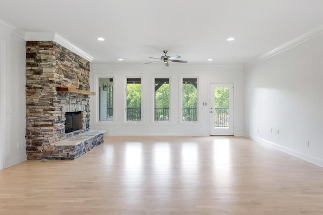 254 Davis Rd, Lebanon, TN 37087 - unfurnished living room with crown molding, light wood finished floors, ceiling fan, a stone fireplace, and baseboards