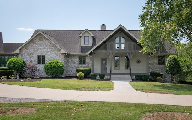 254 Davis Rd, Lebanon, TN 37087 - craftsman-style home featuring a balcony, a chimney, a porch, stone siding, and a front yard