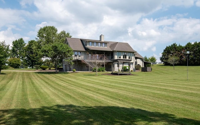 254 Davis Rd, Lebanon, TN 37087 - back of property featuring a yard, a chimney, and a wooden deck