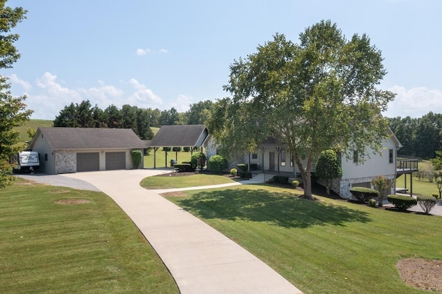 254 Davis Rd, Lebanon, TN 37087 - view of front of house with an attached garage, a front lawn, concrete driveway, and stone siding