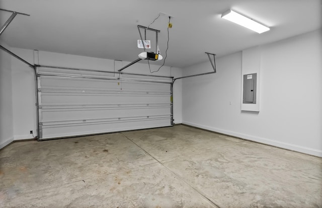 310 Sharp Way, Murfreesboro, TN 37128 - garage with electric panel, a garage door opener, and baseboards