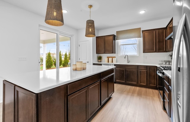 310 Sharp Way, Murfreesboro, TN 37128 - kitchen featuring gas range oven, stainless steel fridge with ice dispenser, light countertops, a sink, and recessed lighting