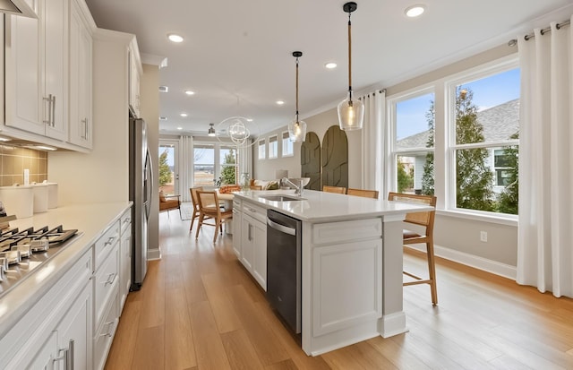 318 Sharp Way, Murfreesboro, TN 37128 - kitchen featuring stainless steel appliances, a sink, light wood-type flooring, recessed lighting, and light countertops