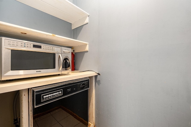 924 Shauna Dr, Nashville, TN 37214 - kitchen view of stainless steel microwave and light countertops