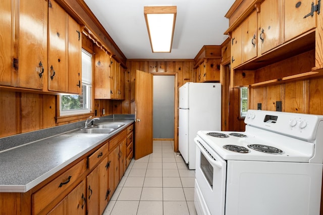 924 Shauna Dr, Nashville, TN 37214 - kitchen featuring white appliances, a sink, plenty of natural light, and light tile patterned floors