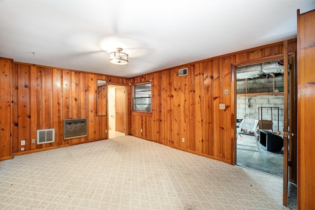 924 Shauna Dr, Nashville, TN 37214 - unfurnished living room with wooden walls, carpet flooring, baseboards, and heating unit