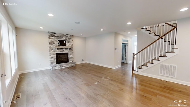2408 Oakmont Ln, Mount Juliet, TN 37122 - unfurnished living room featuring wood finished floors, stairs, baseboards, and recessed lighting