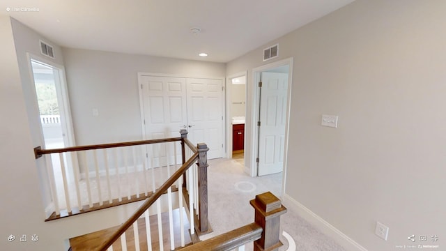 2408 Oakmont Ln, Mount Juliet, TN 37122 - hallway with an upstairs landing, light carpet, baseboards, and recessed lighting