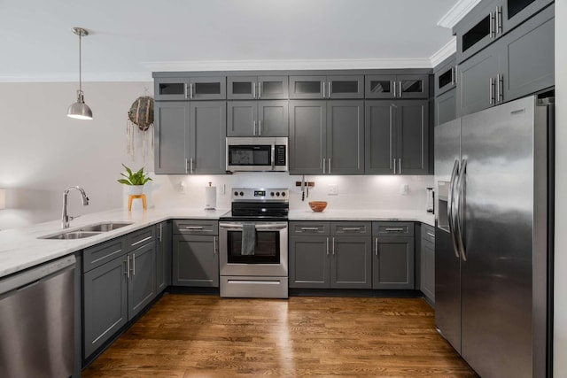 3303 Gallatin Pike Unit 202, Nashville, TN 37216 - kitchen featuring appliances with stainless steel finishes, a sink, ornamental molding, gray cabinetry, and glass insert cabinets