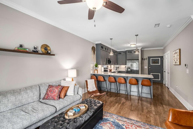 3303 Gallatin Pike Unit 202, Nashville, TN 37216 - living area featuring dark wood-type flooring, baseboards, ceiling fan, and crown molding