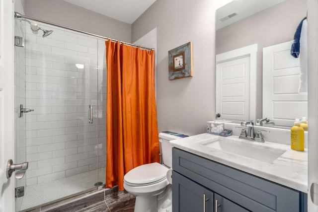 3303 Gallatin Pike Unit 202, Nashville, TN 37216 - full bathroom with a stall shower, toilet, vanity, and wood finished floors
