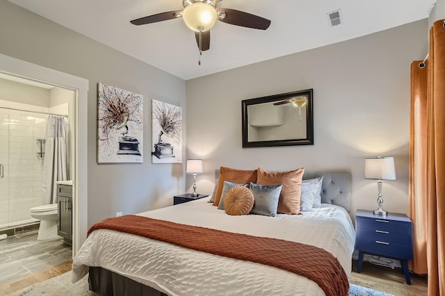 3303 Gallatin Pike Unit 202, Nashville, TN 37216 - bedroom featuring wood finished floors, ensuite bath, and ceiling fan