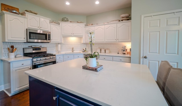 3302 Foxtrot Ct, Spring Hill, TN 37174 - kitchen with appliances with stainless steel finishes, a sink, white cabinetry, and recessed lighting