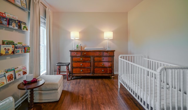 3302 Foxtrot Ct, Spring Hill, TN 37174 - bedroom featuring wood finished floors, multiple windows, a crib, and baseboards