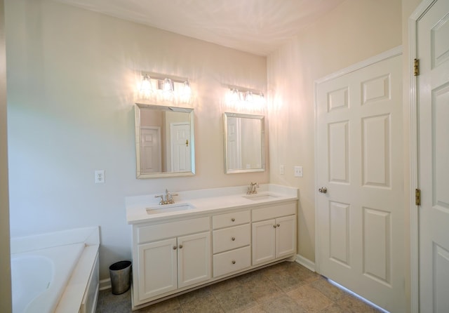 3302 Foxtrot Ct, Spring Hill, TN 37174 - full bathroom with double vanity, a garden tub, and baseboards