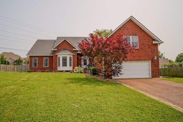 3302 Foxtrot Ct, Spring Hill, TN 37174 - traditional home featuring brick siding, an attached garage, and driveway