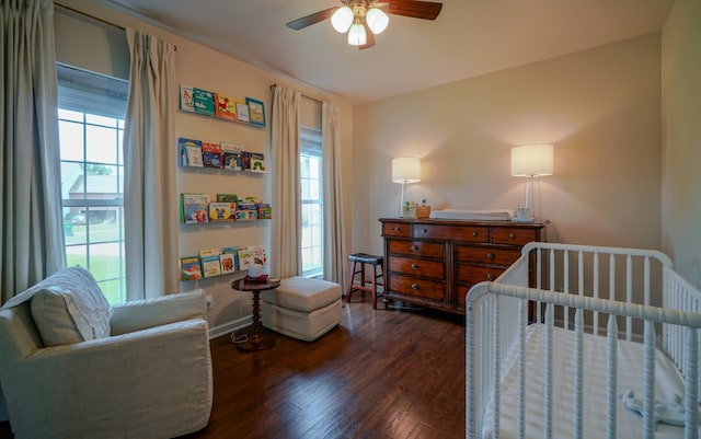3302 Foxtrot Ct, Spring Hill, TN 37174 - bedroom featuring wood finished floors, multiple windows, a crib, and baseboards