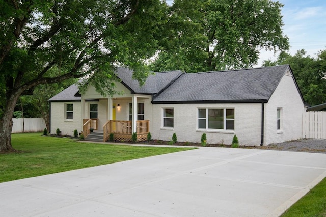 408 Adair Rd, Nashville, TN 37214 - view of front facade with covered porch, roof with shingles, and brick siding