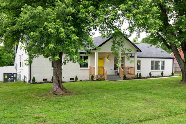 408 Adair Rd, Nashville, TN 37214 - view of front of house with covered porch, brick siding, crawl space, a front lawn, and central air condition unit