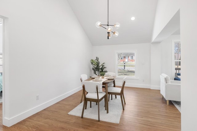 408 Adair Rd, Nashville, TN 37214 - dining area featuring high vaulted ceiling, wood finished floors, baseboards, and a chandelier