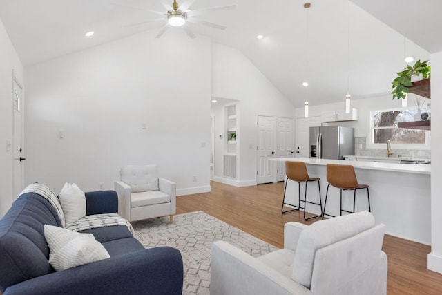 408 Adair Rd, Nashville, TN 37214 - living room featuring light wood-type flooring, high vaulted ceiling, a ceiling fan, recessed lighting, and baseboards