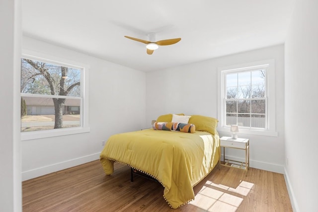 408 Adair Rd, Nashville, TN 37214 - bedroom featuring multiple windows, light wood-type flooring, and baseboards