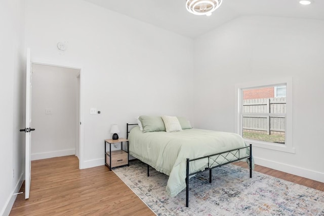 408 Adair Rd, Nashville, TN 37214 - bedroom with baseboards, wood finished floors, and high vaulted ceiling