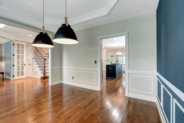 106 Ashton Park Blvd, Franklin, TN 37067 - empty room with a decorative wall, dark wood-style floors, french doors, stairs, and a wainscoted wall