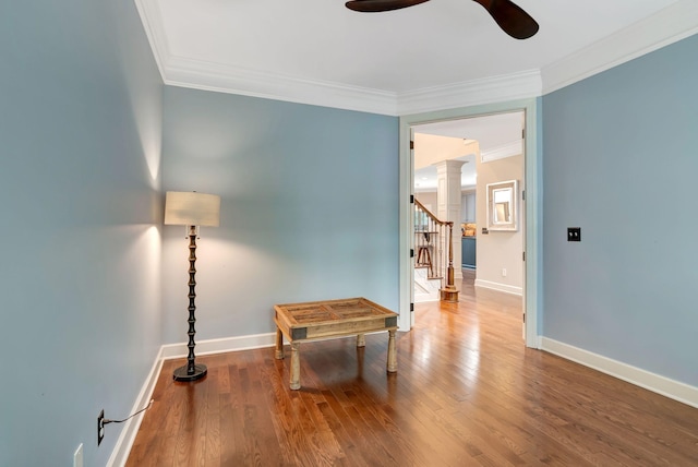 106 Ashton Park Blvd, Franklin, TN 37067 - living area with ceiling fan, crown molding, wood finished floors, stairway, and decorative columns