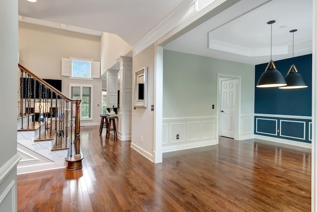 106 Ashton Park Blvd, Franklin, TN 37067 - foyer entrance with wood finished floors, a tray ceiling, stairs, a decorative wall, and ornate columns