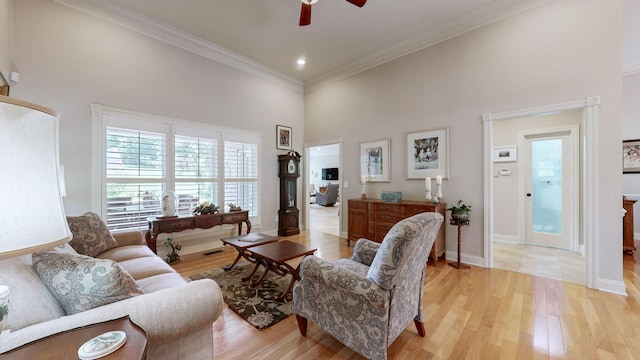 516 Letcher Ave, Lebanon, TN 37087 - living area featuring a high ceiling, a ceiling fan, crown molding, light wood-style floors, and baseboards